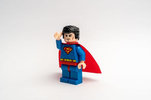 A closeup shot of the Lego superman mini-figure flight pose