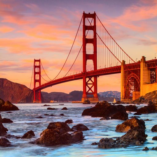 A landscape of the Golden Gate Bridge during a breathtaking sunset in California