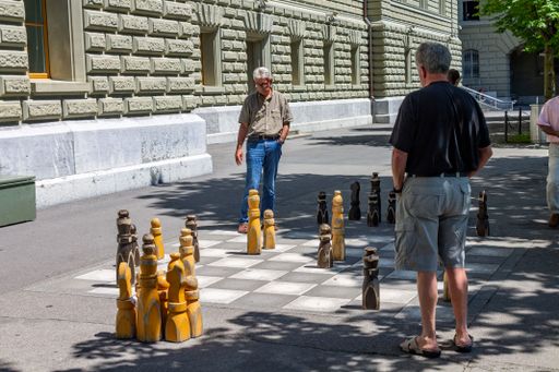 The old men playing chess on the street floor in Bern, Switzerland