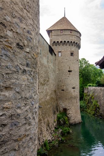 A vertical shot of the part of the medieval Chillon Castle on the Lake Geneva, Veytaux, Switzerland