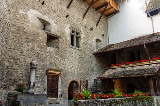 A beautiful shot of the courtyard inside the medieval Chillon castle in Veytaux, Switzerland