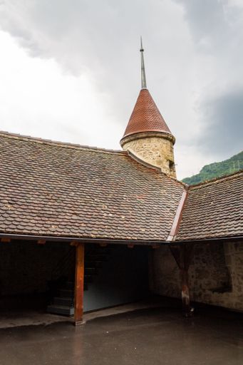 A vertical shot of the Chillon Castle on a cloudy day in Veytaux, Switzerland