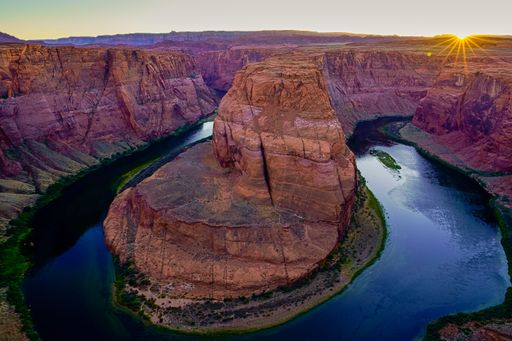 An aerial view of the Horseshoe Bend during sunset in Glen Canyon, Page, Arizona, United States