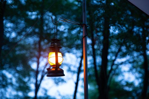 A closeup shot of a small lamp on the blurry background