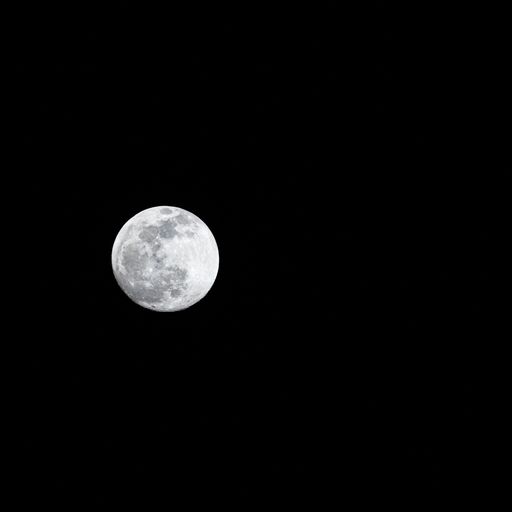 The full moon in the late night sky