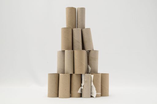 Empty Toilet Rolls Stack Up On a Black Background