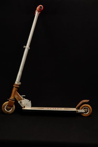 Metal scooter for child on white background