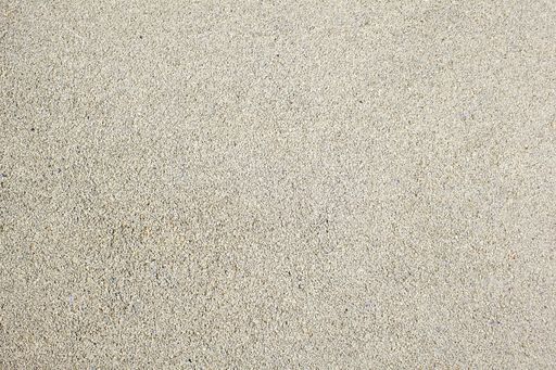 A closeup shot of the sand during daytime