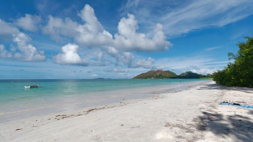 A mesmerizing seascape view with sandy beach and calm sea waves in Aldabra Atoll, Seychelles