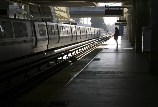 A beautiful shot of a female standing in an empty train station