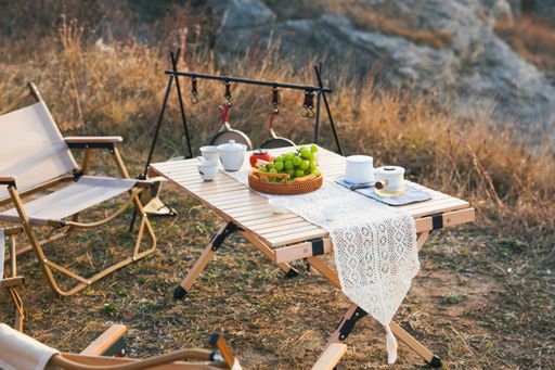 A table with grapes and tea in the nature