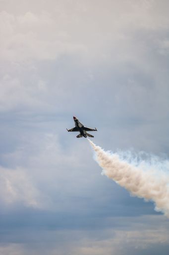 A low-angle vertical shot of thunderbirds flying over the sky at the Skyfest 2022 airshow in Spokane, USA.