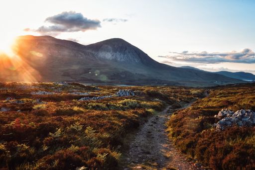 A beautiful rocky field with breathtaking sunny and cloudy sky