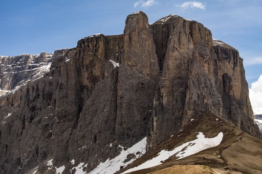 A beautiful shot of the Dolomite Mountains with blue sky above during daylight