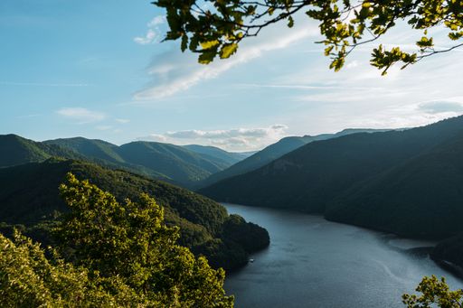 An aerial view of a beautiful lake near the mountains
