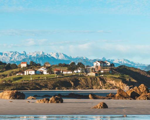 A landscape shot of mountain ranges on a beach outside San Vicente de la Barquera