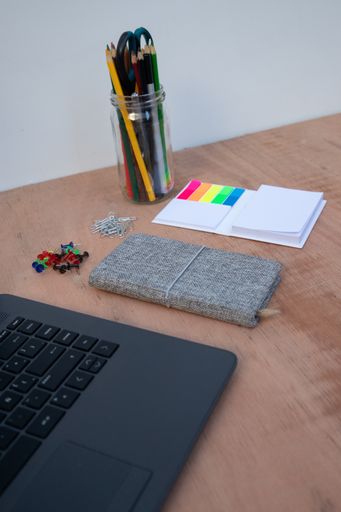 The office supplies and a laptop on a desk to work from home because of Covid-19