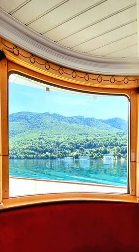 A beautiful view of the island with trees from the window of the ship