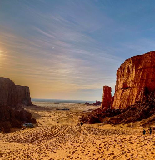 An aerial view of desert with rock formations in Algeria during sunset
