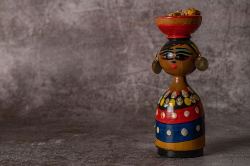 malaga, spain may 29, 2022 hand-painted terracotta figure of a traditional handmade woman in close-up isolated close-up