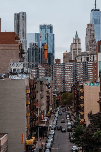 A high angle shot of the cityscape and streets of New York City, USA on a cloudy day