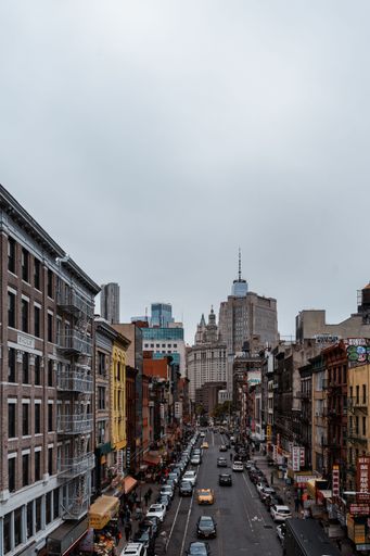 A high angle shot of the cityscape and streets of New York City, USA on a cloudy day