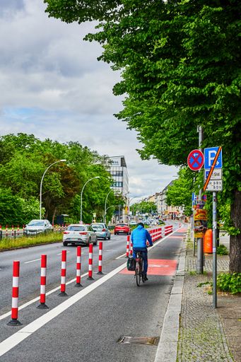 Berlin, Germany - May 29, 2022: Cyclist in a dedicated cycle lane on a main road to improve road safety.