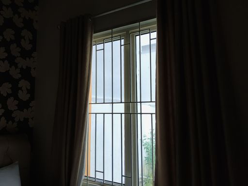 A beautiful shot of a window of a dark room