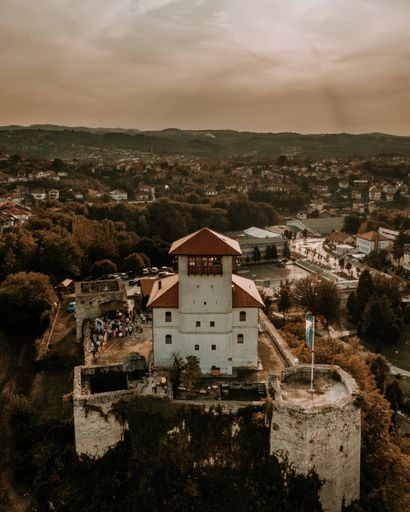 An aerial vertical shot of the Gradacac Castle under a cloudy sky in Bosnia, Herzegovina