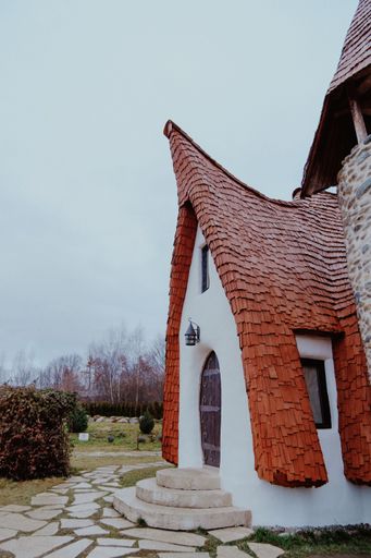 A white funny fairytale-style castle in the park