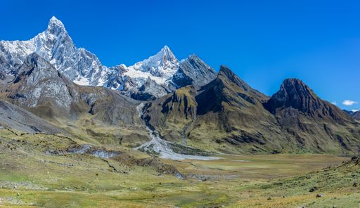 A beautiful landscape shot of the breathtaking mountain range of the Cordillera Huayhuash in Peru. Perfect for a wallpaper or a background.