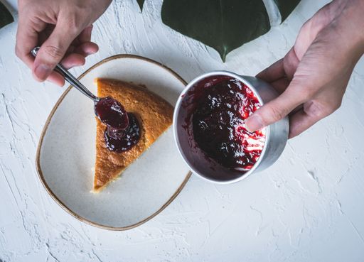 A top view close-up of a piece of berry pie on a plate