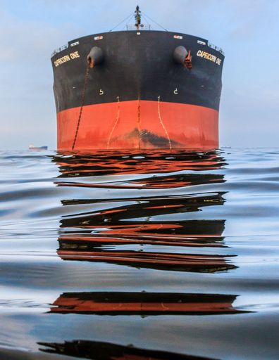 A vertical shot of the container ship docked in the Chesapeake Bay.