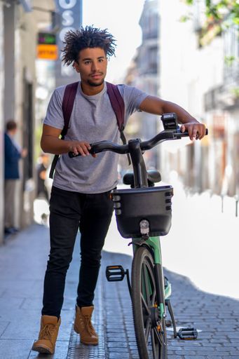 young afro with his rental bike