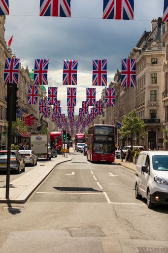 A vertical shot of British flags hanging on the street before the Queen 70'th Jubilee in London