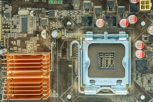 The components of the motherboard, including a chip, ic, CPU socket, heatsink, and many ports