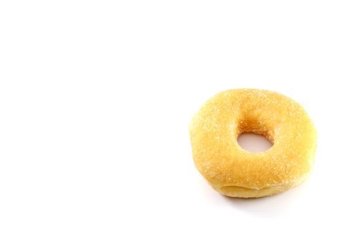 A closeup of a doughnut isolated on a white background with copy space