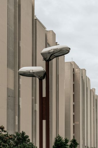 The brutalist concrete architecture of the residential area with street lamps in Split, Croatia