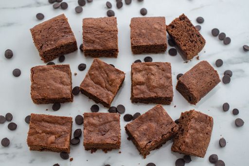 A closeup of delicious brownie cake on a white table