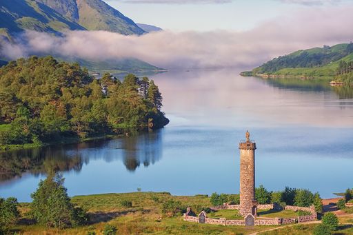 A high angle of the Jacobite monument overlooking Loch Shiel, Glenfinnan, Scotland on a misty morning