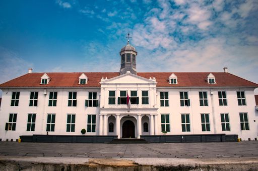 A low angle shot of the beautiful Jakarta History Museum in Indonesia against a blue sky