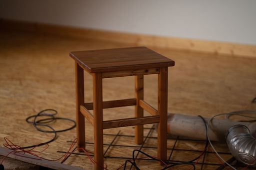 A classic solid wood chair in a room