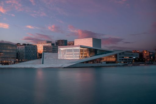 A scenic view of the National Opera House in Oslo, Norway, at sunset