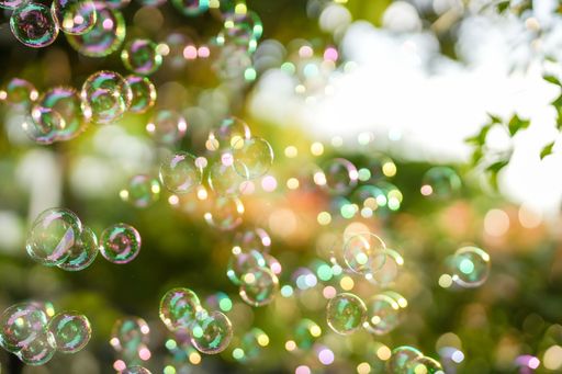 A closeup shot of soap bubbles on green nature background