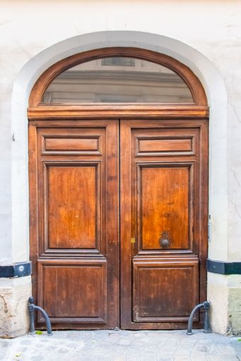 Paris, an old wooden door, typical building in the Marais