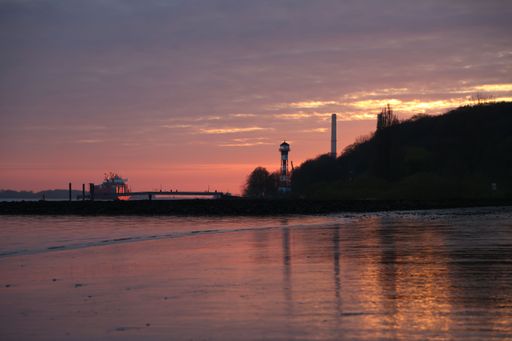 A scenic sunset with afterglow at the river Elbe in Hamburg, Germany