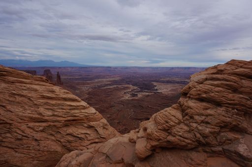 A mesmerizing view of Canyonlands National Park under a cloudy sky in Utah, USA