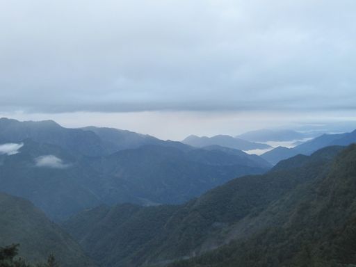 A beautiful view of Yushan also known as Mount Jade and hills on a foggy day in Taiwan
