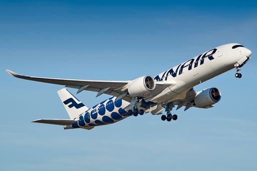 The Finnair plane flying in the sky