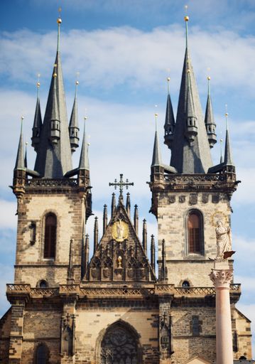 A vertical shot of the St. Vitus Cathedral in Prague under a blue clear sky